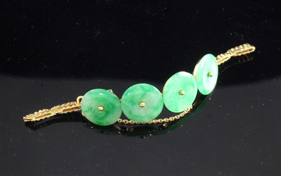 A Chinese high carat gold and jadeite bracelet, gross weight 15.5 grams.